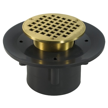 Jones Stephens 4in. Heavy Duty PVC Slab Drain Base with 3-1/2in. Metal Spud and 5in. Polished Brass Strainer D49555
